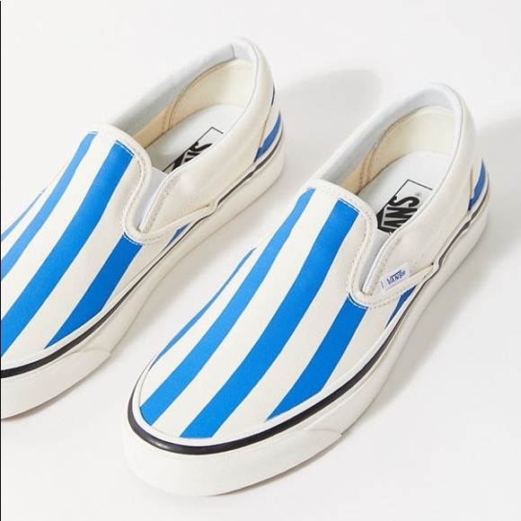 blue slip on vans with checkered stripe